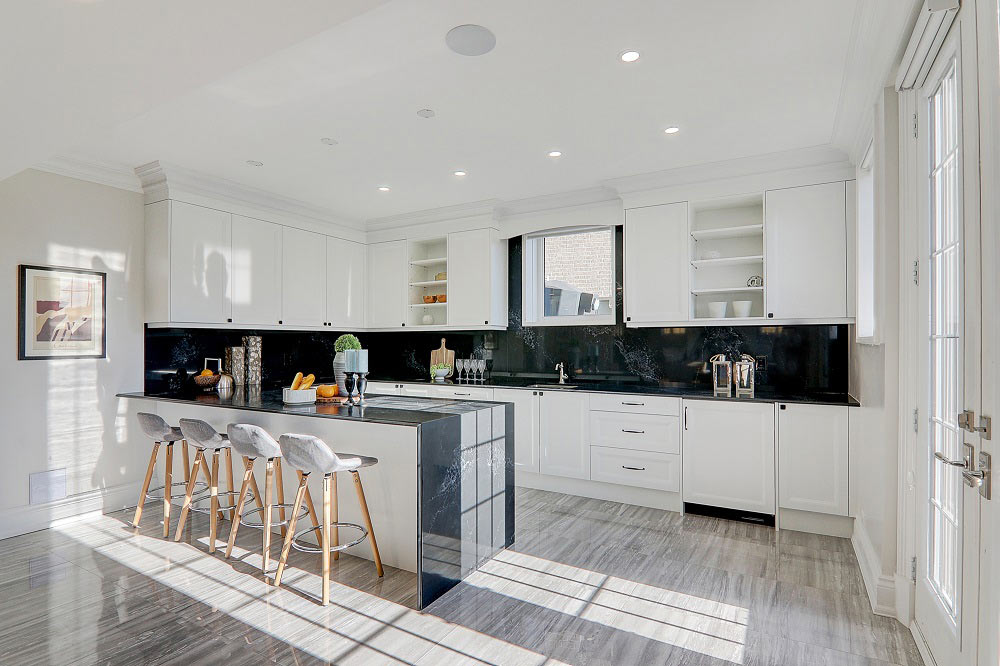 white luxury kitchen with bar table