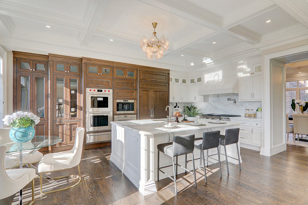 luxury kitchen with white table and brown cabinet